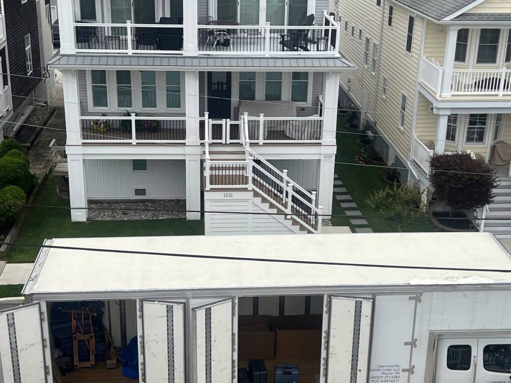 LiteMovers truck parked in front of white beach house during Jersey Shore residential move